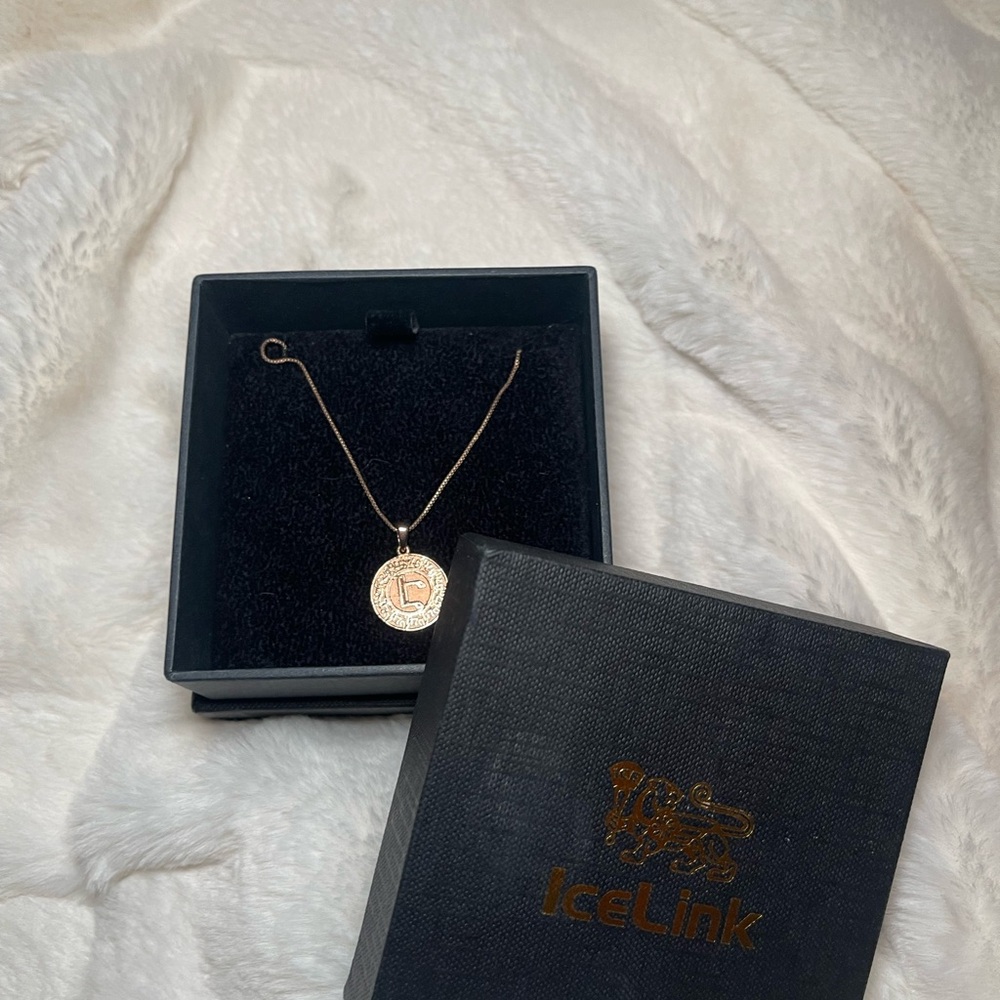 Rose gold Ice Link necklace with an Armenian initial “E” on it